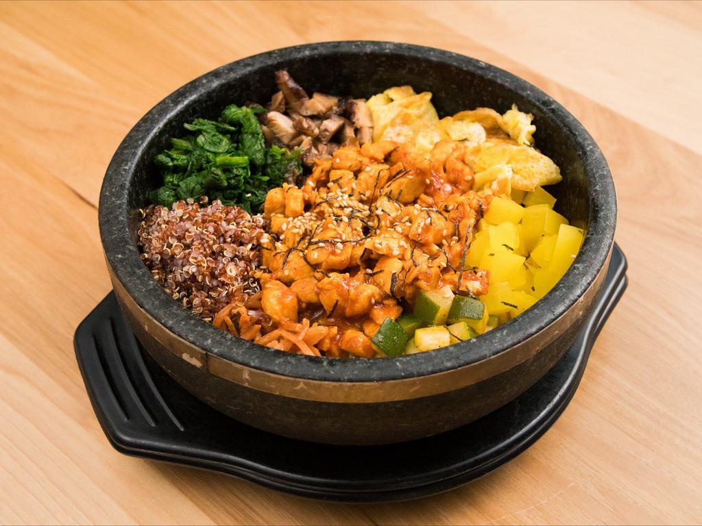Bibimbap · White rice, quinoa, assorted seasonal vegetables and egg noodles, with Bonchon red pepper paste on the side.