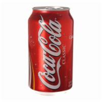 Coke  · 20 oz. can. 