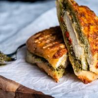 Pesto Chicken Panini · Grilled Chicken Breast, Pepper Jack Cheese, Roasted Red Peppers, topped with Basil Pesto gri...