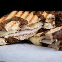 Turkey and Swiss Sandwich · Oven-roasted Turkey Breast with Swiss Cheese topped with Garlic Mayo grilled on a Pumpernick...