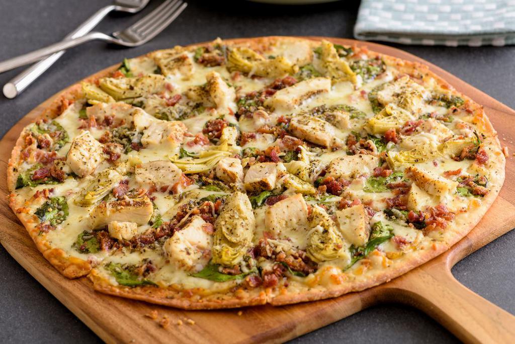 Chicken Bacon Artichoke Pizza (Baking Required) · Grilled Chicken, Crispy Bacon, Marinated Artichoke Hearts, Fresh Spinach, Whole-Milk Mozzarella, Aged Parmesan and Zesty Herbs, topped with Creamy Garlic Sauce on Our Artisan Thin Crust