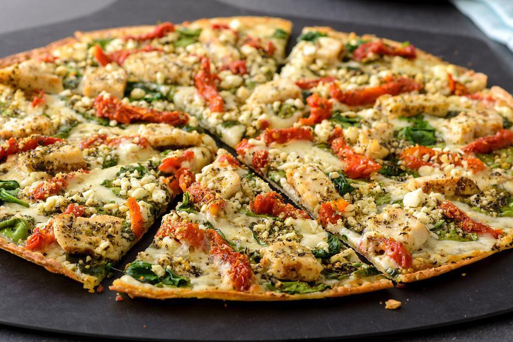 Herb Chicken Mediterranean Pizza (Baking Required) · Olive oil and garlic, mozzarella, chicken, spinach, sun-dried tomatoes, feta and zesty herbs. Recommended on a thin crust.