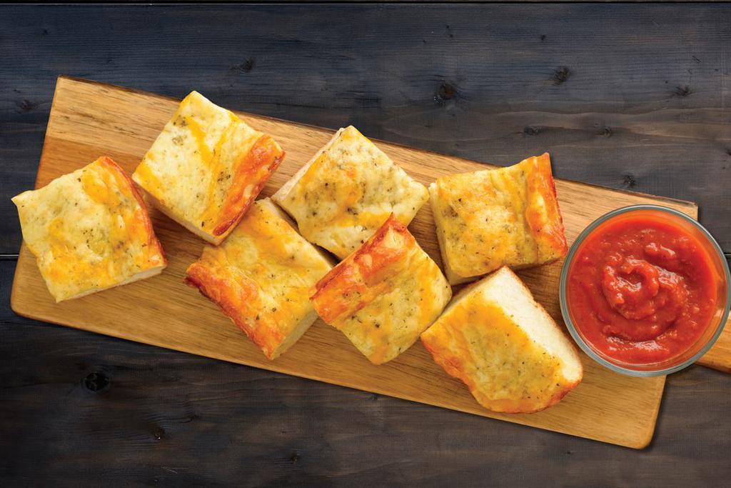 Scratch-Made 5 Cheese Bread (Baking Required) · Fresh dough topped with our Herb Garlic Spread, 1⁄4
pound of Whole-Milk Mozzarella, Herb & Cheese Blend, and Mild Cheddar Cheese served with a side of Marinara
