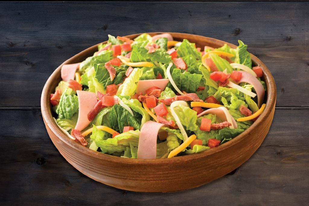 Club Salad · Romaine, bacon, Canadian bacon, Roma tomatoes, a blend of mozzarella and cheddar cheeses and ranch dressing.