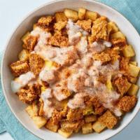 Chicken Fried Steak Bowl · Feeling country? Seasoned country potatoes topped with scrambled eggs mixed with sautéed dic...