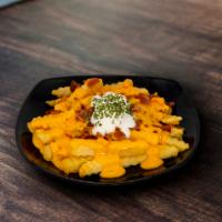 Smothered Cheese Fries · One-Half Pound of Straight-cut potato fries smothered in queso, topped with sour cream chive...