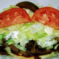 Gyro Sandwich · Gyro sandwich made on pita bread, meat cook on grill. Dress with Lettuce, onion, tomato, & t...