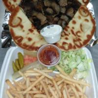 Gyro Dinner · With extra gyro meat  2 pitabreads, lettuce, onion, tomatoes, pickle, sports paper & tzatzik...