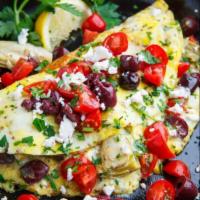 Mediterranean Style Omelette · Olives, feta cheese, tomatoes, spinach and chives.
