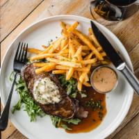 Steak Frites · Peppered New York steak, herb butter, fries, house aioli.