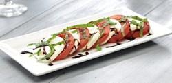 Insalata Caprese · Fresh mozzarella, tomatoes, and basil topped with balsamic glaze and olive oil.