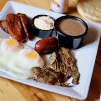 Steak and Eggs · Carne Asada, Two eggs, one chorizo, plantains, beans and cream