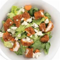 Buffalo Chicken Salad · Breaded Tenders tossed in your choice of sauce, served over a bed of lettuce with carrots, c...