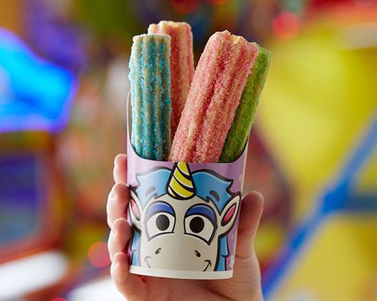 Unicorn Churros · Dusted with blue raspberry, cotton candy, and sour apple sugar – a true fantasy!