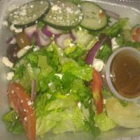 House Salad · Blend of tossed romaine lettuce, tomatoes, cucumbers and onions topped with feta cheese, oli...