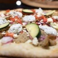 Chicken Gyro Pizza · White pizza sauce, marinated chicken gyro meat, tomatoes, cucumbers, feta cheese and drizzle...