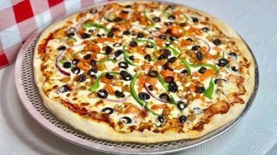 Premium Shrimp Pizza · Sauteed shrimps, onions, green peppers, olives and tomatoes.
