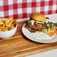Gyro Burger Meal · 5 oz. Mediterranean seasoned lamb beef gyro on a toasted  bun topped with green leaf, tomato...