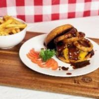 Cowboy Burger Meal · 6 oz. Seasoned Angus beef patty on a toasted bun topped with BBQ sauce, turkey bacon cheddar...