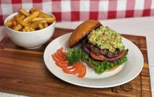 Guacamole Burger Meal · 6 oz. Seasoned Angus beef patty on a toasted bun topped with guacamole lettuce tomatoes and onions served with french fries.