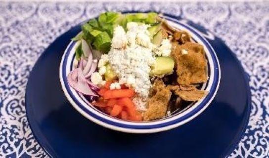 Beef And Lamb Gyro Bowl · Marinated beef or lamb gyro meat served with rice, lettuce, cucumbers, tomatoes, onions, feta and tzatziki.