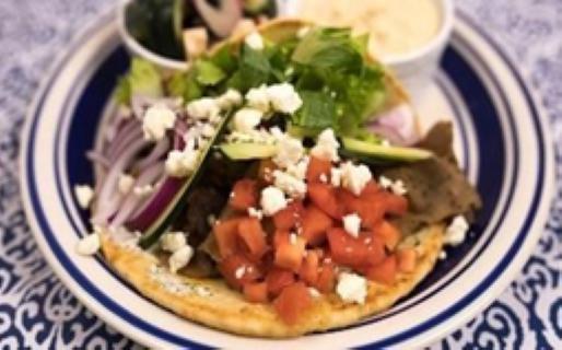 Classic Chicken Gyro Meal · Served with Greek salad and a side of hummus.