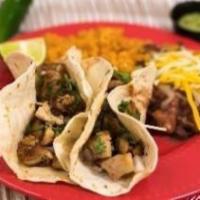 2 Shrimp Tacos Meal · Sautee Rock Shrimps, Pico de Gallo and salsa served with Mexican rice and pinto beans.