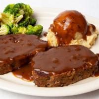 Ma More Meatloaf Dinner · Our homemade meatloaf served with mashed potatoes, gravy and veggies and topped with fried o...