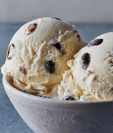 Vanilla Swiss Almond Ice Cream · An almond lover's delight. Our dry-roasted almonds are lightly coated with sweet chocolate and combined with our distinctive vanilla ice cream. Simple yet perfect.