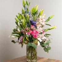 Deluxe Arrangement in a Vase · An extravagant luxurious arrangement of seasonal flowers.