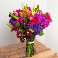 Vibrant Primary Colors Wrapped Bouquet · The colors of the rainbow in all of their showiest tones.

Seasonal options may vary through...