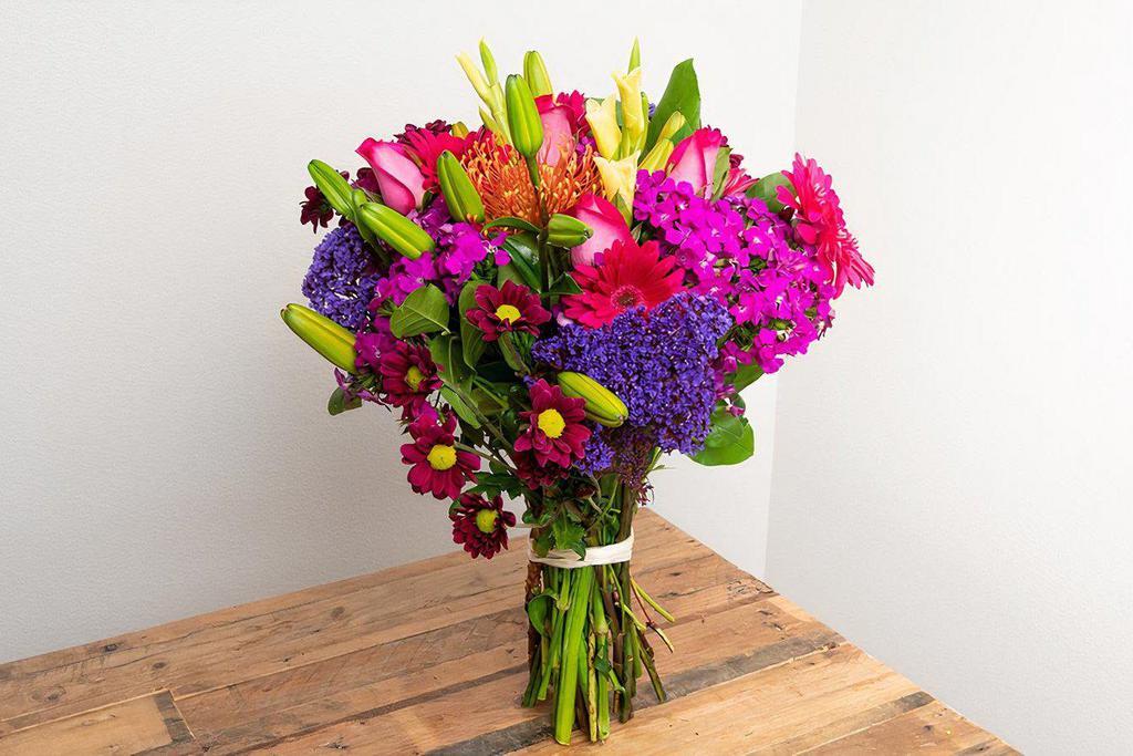 Vibrant Primary Colors Wrapped Bouquet · The colors of the rainbow in all of their showiest tones.

Seasonal options may vary throughout the year and depending on location. Our florist will provide the best available flowers for your order!