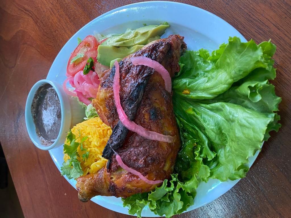 POLLO ASADO · Grilled chicken rubbed in annatto seasoning. Served with rice, refried black beans, side salad and homemade tortillas.