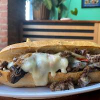 PHILLY CHEESESTEAK · Steak, Jack cheese, onions, bell peppers, mushrooms and special sauce. 