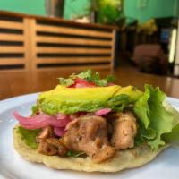 CHICKEN TACO · Refried black beans, lettuce and tomato, chicken on a handmade tortilla