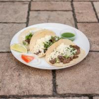 Taco de Carne · Order of 3 Steak tacos, grilled to perfection, topped with cheese, cilantro, and raw onions....