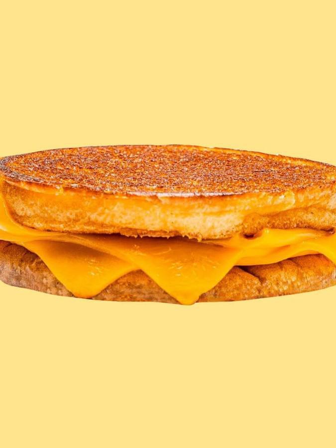 Karl’s Grilled Cheese  · 3 slices of American cheese griddled crisp on an inverted bun.