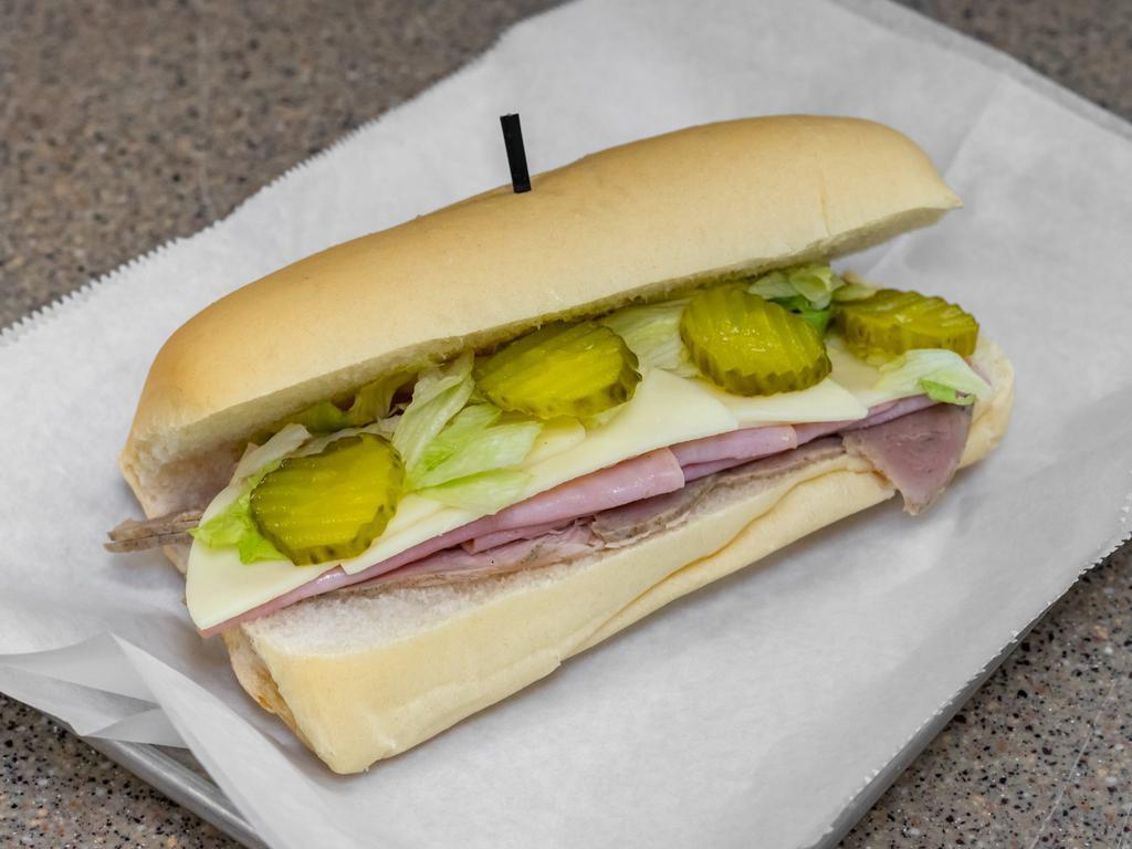 Cuban Sandwich · Roasted pork, ham and cheese served on white bread with your choice of garnish.