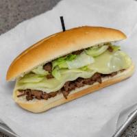 Philly Steak and Cheese Sandwich · Piled high with meaty beef, caramelized onion sub with your choice of cheese and fresh veggi...