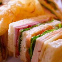 Club · Ham, turkey, bacon, lettuce, tomatoes, swiss and mayonnaise on sourdough bread