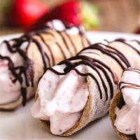 Four Dessert Chocolate Chip Cannolis · Four Cannolis with a hint of Cinnamon stuffed with Chocolate Chip Crème Filling and topped w...