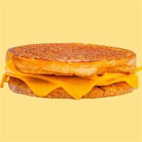 Karl's Grilled Cheese · 3 slices of American cheese griddled crisp on an inverted bun