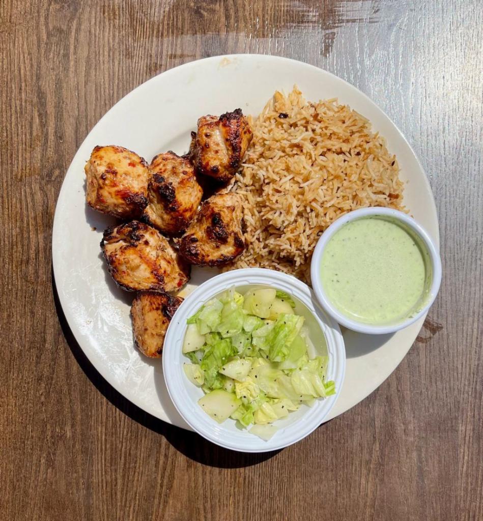 1. Six Piece Malai Tikka Platter · Supreme chicken with ginger, garlic, green chili, cream-cheese, coriander-stem and cardamom. Served with Side of Mint Sauce, Salad and Choice of Rice or Naan Bread.
