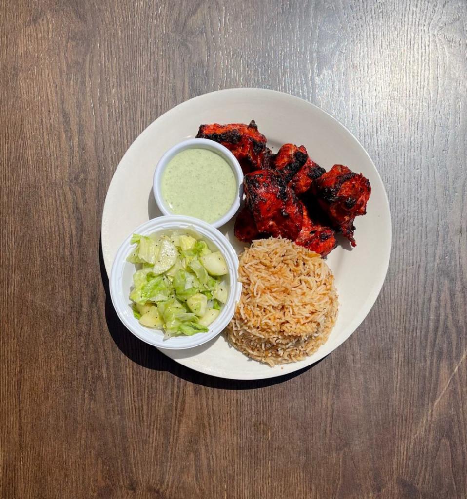 2. Six Piece Chicken Tikka Platter · Chicken pieces baked using skewers in Tandoor Oven, marinated in yogurt, onion, spices and sauce. Served with Side of Mint Sauce, Salad and Choice of Rice or Naan Bread.