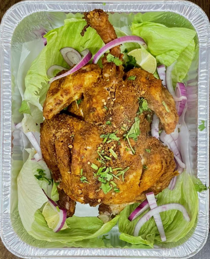 13. Lahori Charga Platter · Soft & Spicy whole chicken is marinated overnight, with Lahori Masala, cooked on steam to perfection. Served with Side of Mint Sauce, Salad and Choice of Rice or Naan Bread.