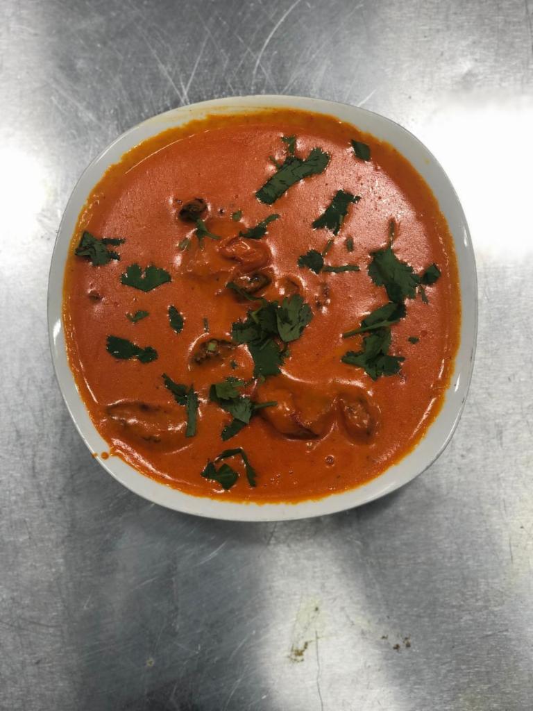 Chicken Tikka Masala · Chicken tikka, boneless chunks of chicken marinated in spices and yogurt that are roasted in an oven, served in a creamy curry sauce. Order Sides Separately.
