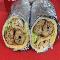 Chicken Seekh Kabab Wrap · Chicken Seekh Kabab wrapped in Naan Bread along with Mayo, lettuce, tomato and onions.
