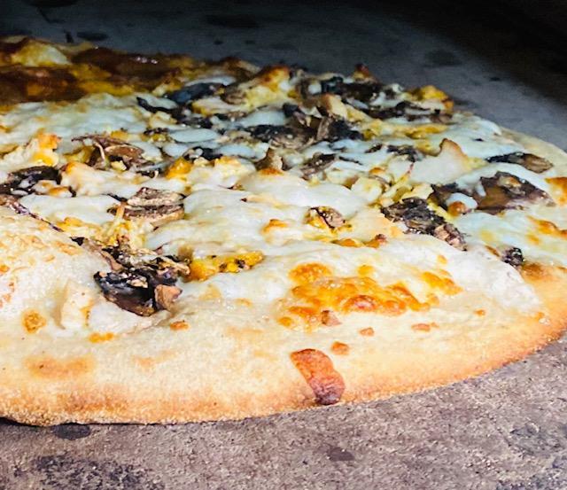 Chicken Alfredo Pizza  · Our special alfredo sauce, kosher rosemary chicken, onions, fresh garlic and green olives. 