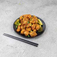 General GAU'S Chicken · The deep fried nuggets of boneless chicken tossed in sweet spicy sauce and served on a bed o...
