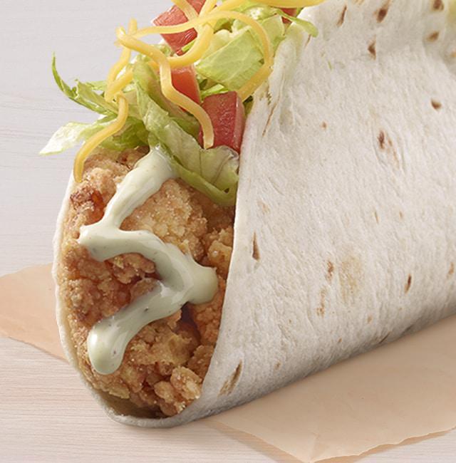 Cantina Crispy Chicken Taco with Avocado Ranch · A flour tortilla filled with crispy chicken, lettuce, tomatoes, cheddar cheese, and avocado ranch sauce.
